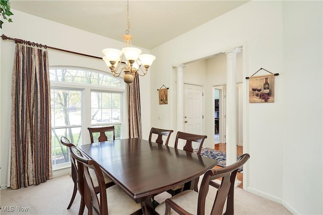 3563 Saint Andrews Ln, Richfield, OH 44286 - dining room with light carpet, a chandelier, healthy amount of natural light, and baseboards