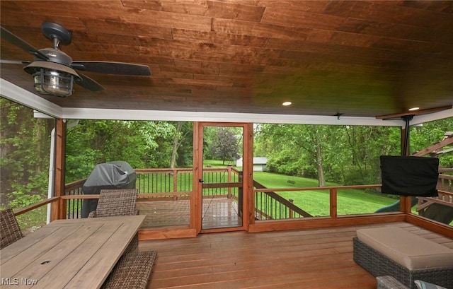 3576 Ellen Dr, Akron, OH 44312 - deck with ceiling fan, a lawn, and grilling area