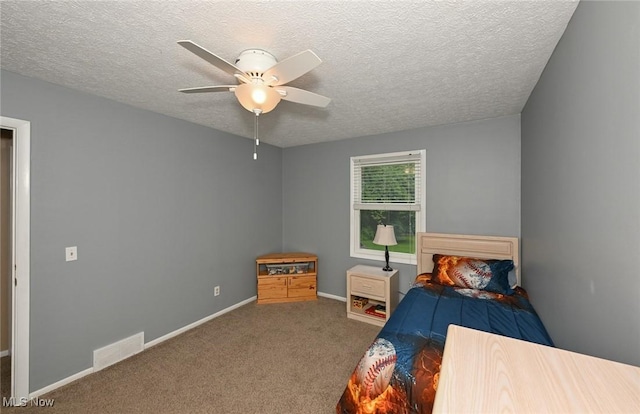 3576 Ellen Dr, Akron, OH 44312 - bedroom featuring a textured ceiling, carpet flooring, baseboards, and a ceiling fan