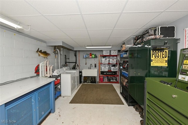 3576 Ellen Dr, Akron, OH 44312 - finished below grade area featuring washer and dryer, a drop ceiling, concrete block wall, and a sink