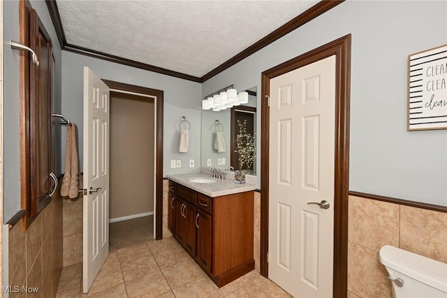 3576 Ellen Dr, Akron, OH 44312 - bathroom featuring tile patterned floors, vanity, toilet, a textured ceiling, and ornamental molding