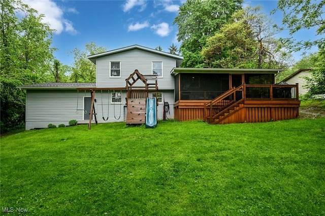 3576 Ellen Dr, Akron, OH 44312 - rear view of house with a sunroom, a wooden deck, a yard, and stairway