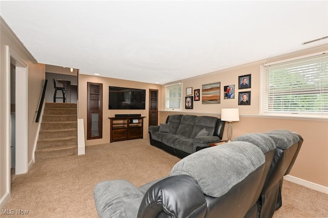 3576 Ellen Dr, Akron, OH 44312 - living room featuring light carpet, stairway, and baseboards