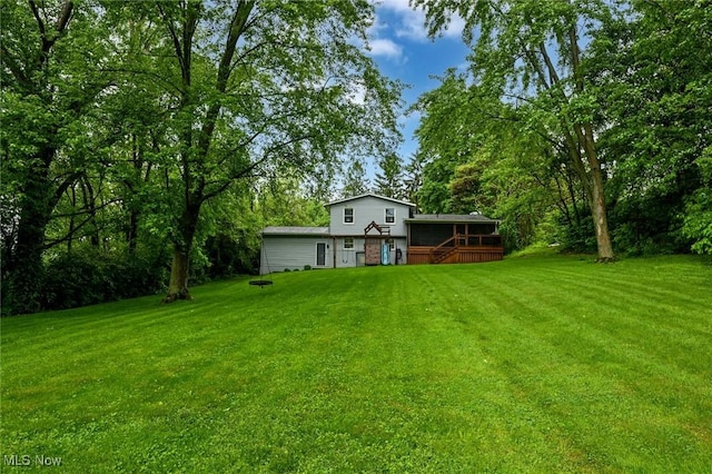 3576 Ellen Dr, Akron, OH 44312 - view of green lawn featuring a wooden deck