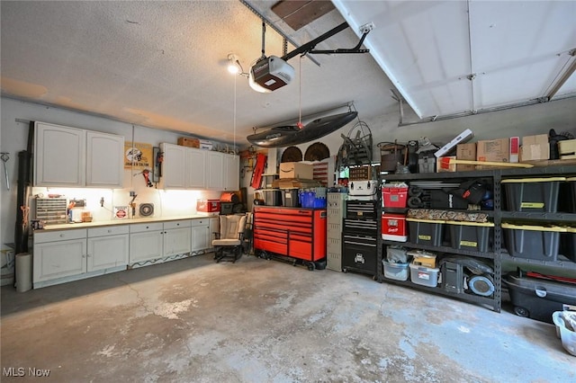 3576 Ellen Dr, Akron, OH 44312 - garage featuring a garage door opener