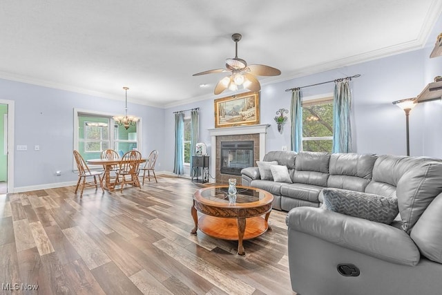 5215 Kapok Dr, Medina, OH 44256 - living room featuring plenty of natural light, ornamental molding, light wood-style flooring, and a ceiling fan