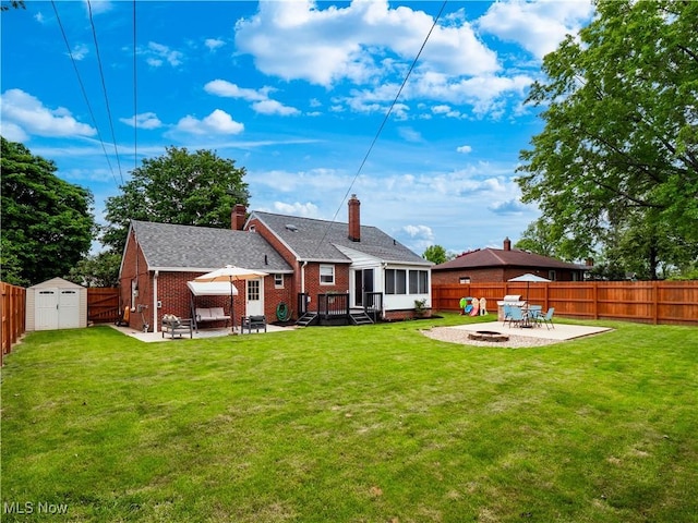 4482 Ranchview Ave, North Olmsted, OH 44070 - rear view of property featuring a patio, a fire pit, brick siding, and a chimney