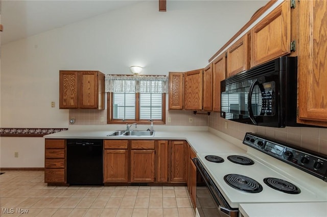 14250 Reserve Ln, Middleburg Heights, OH 44130 - kitchen with black appliances, a sink, brown cabinets, and high vaulted ceiling