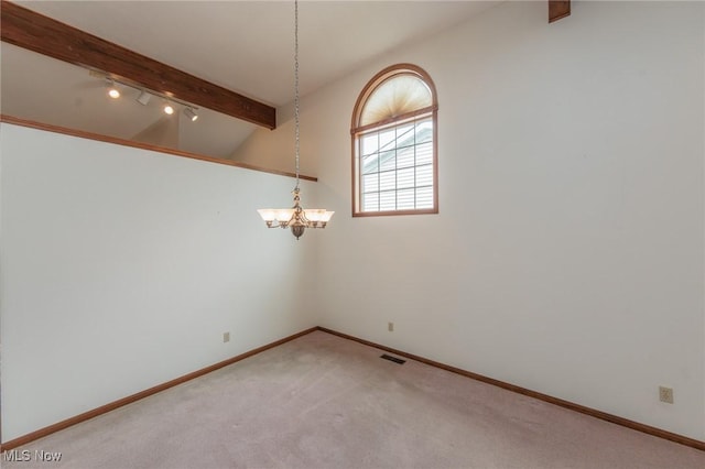 14250 Reserve Ln, Middleburg Heights, OH 44130 - empty room with a chandelier, light carpet, baseboards, and track lighting