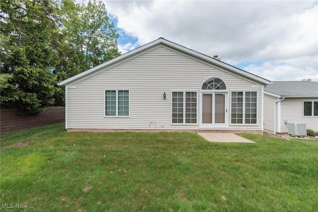 14250 Reserve Ln, Middleburg Heights, OH 44130 - rear view of house featuring cooling unit and a yard