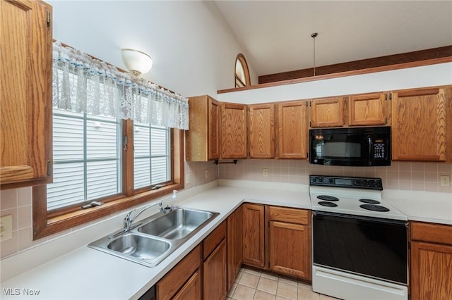 14250 Reserve Ln, Middleburg Heights, OH 44130 - kitchen featuring black microwave, electric range, a sink, decorative backsplash, and brown cabinets