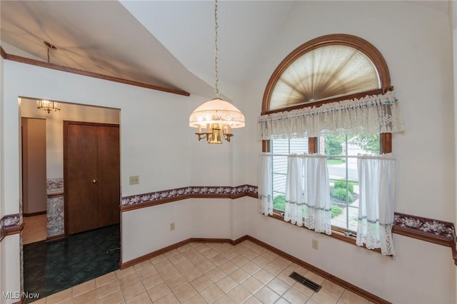 14250 Reserve Ln, Middleburg Heights, OH 44130 - empty room featuring a chandelier, vaulted ceiling, light tile patterned flooring, and baseboards