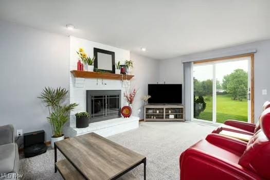 1339 Harmony Dr, Wadsworth, OH 44281 - living area featuring a large fireplace and carpet flooring