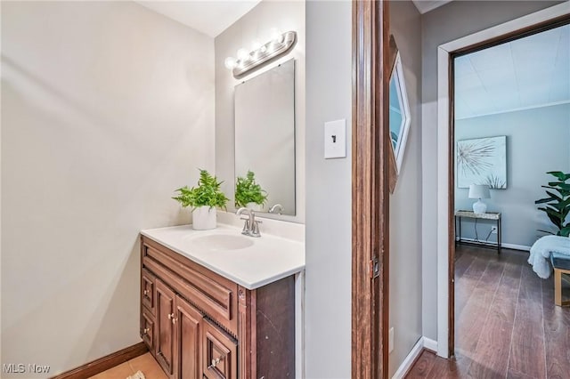 298 W Chestnut St, Lisbon, OH 44432 - bathroom featuring vanity, baseboards, and wood finished floors