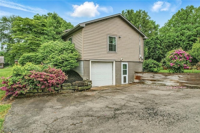 298 W Chestnut St, Lisbon, OH 44432 - view of home's exterior with an attached garage