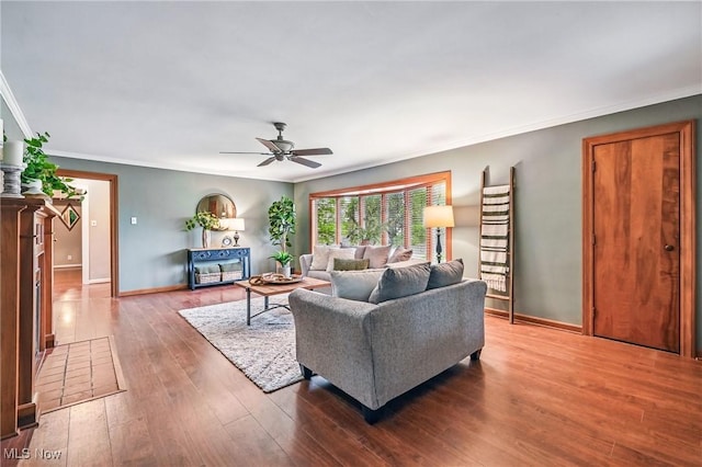 298 W Chestnut St, Lisbon, OH 44432 - living room featuring ornamental molding, baseboards, ceiling fan, and wood finished floors