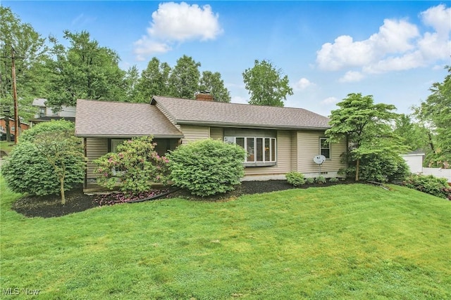 298 W Chestnut St, Lisbon, OH 44432 - view of front of home featuring a front lawn, a chimney, and roof with shingles