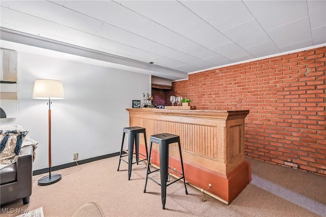 298 W Chestnut St, Lisbon, OH 44432 - indoor dry bar with brick wall, carpet flooring, and baseboards