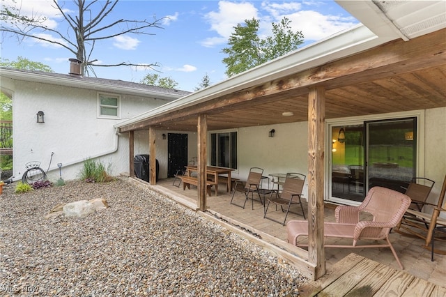 17801 Ellsworth Rd, Lake Milton, OH 44429 - rear view of house featuring stucco siding and a patio