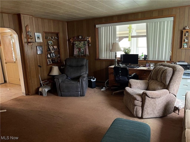 455 Smithfield St, Dillonvale, OH 43917 - carpeted living room with arched walkways, wood walls, and an office area