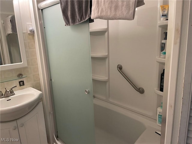 455 Smithfield St, Dillonvale, OH 43917 - bathroom with an enclosed shower, vanity, and decorative backsplash