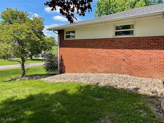 6391 Viking, East Canton, OH 44730 - view of side of home featuring a lawn and brick siding