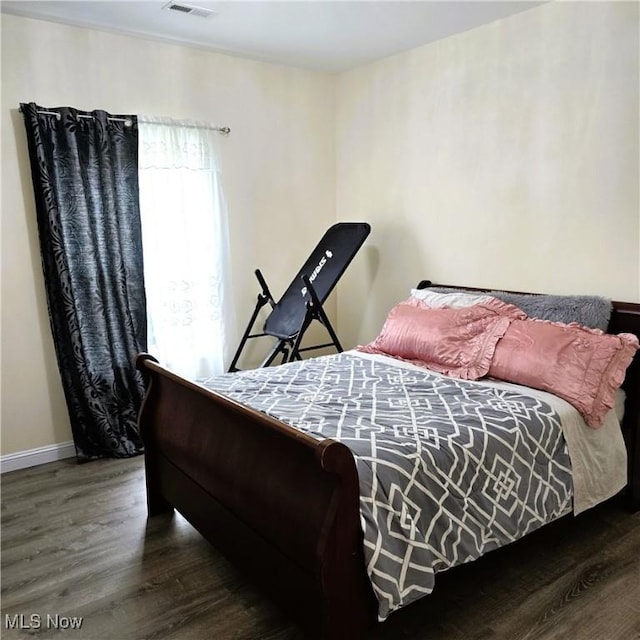 6363 Lockhaven Dr, Brook Park, OH 44142 - bedroom featuring wood finished floors and baseboards