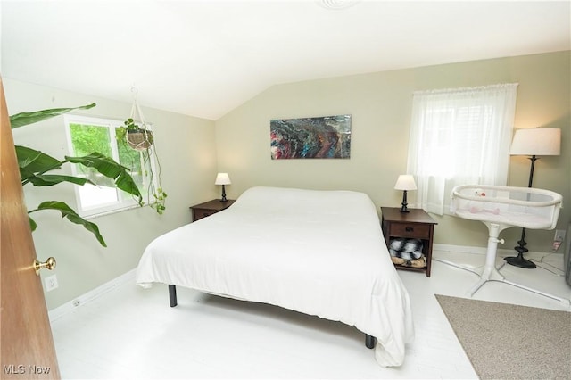 1087 Madrid Dr, Akron, OH 44313 - bedroom featuring baseboards and lofted ceiling