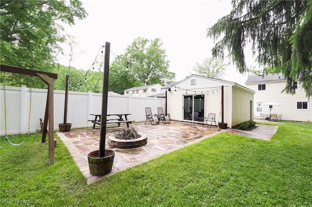 1087 Madrid Dr, Akron, OH 44313 - view of yard featuring a patio area and an outdoor fire pit