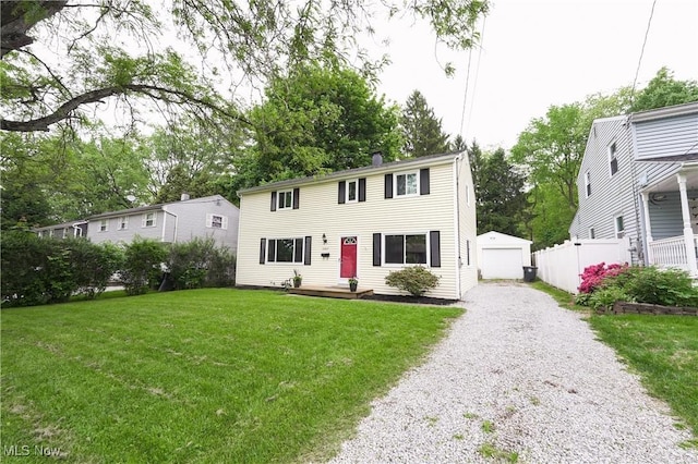 1087 Madrid Dr, Akron, OH 44313 - colonial inspired home with an outbuilding, gravel driveway, and a garage
