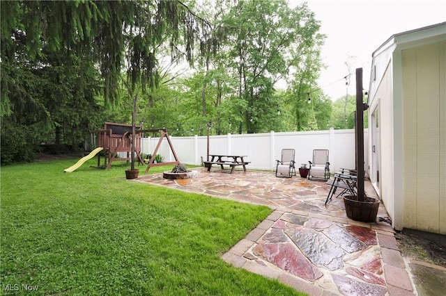 1087 Madrid Dr, Akron, OH 44313 - view of yard with a patio area, a playground, and an outdoor fire pit