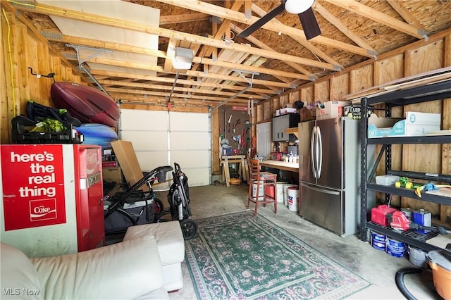 1087 Madrid Dr, Akron, OH 44313 - garage with freestanding refrigerator and a ceiling fan