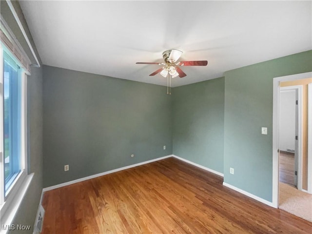 2330 Judy Dr, Parma, OH 44134 - spare room featuring ceiling fan, wood finished floors, and baseboards