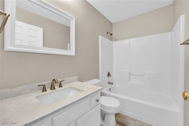 3527 Perry Ct, Lorain, OH 44053 - bathroom featuring toilet, vanity, bathing tub / shower combination, and a textured ceiling