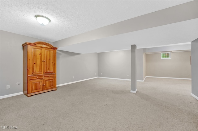 3527 Perry Ct, Lorain, OH 44053 - basement featuring light carpet, baseboards, and a textured ceiling