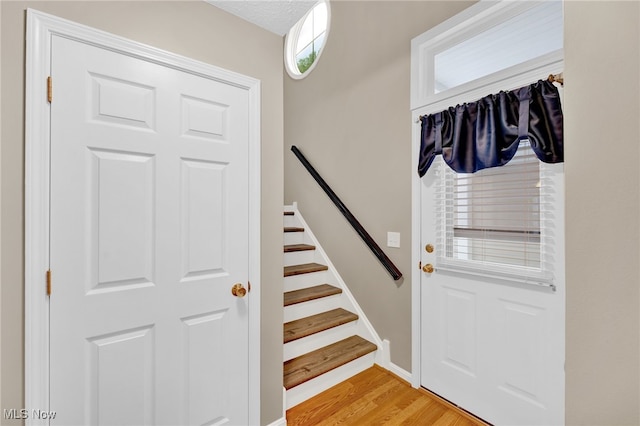3527 Perry Ct, Lorain, OH 44053 - doorway to outside with light wood-style floors and stairs