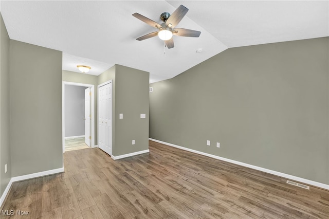 3527 Perry Ct, Lorain, OH 44053 - empty room featuring a ceiling fan, baseboards, wood finished floors, and vaulted ceiling