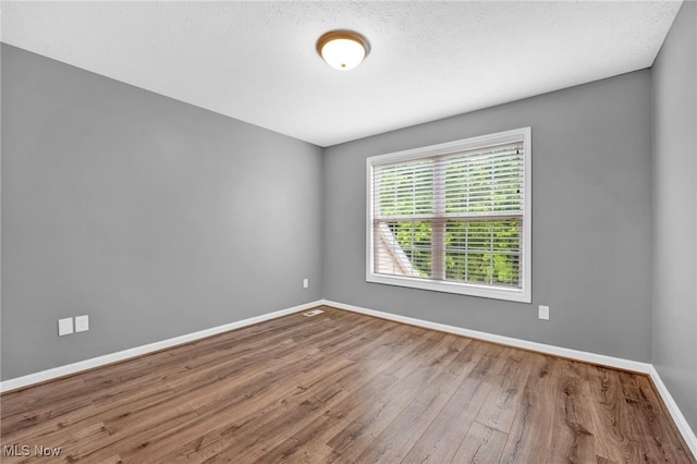 3527 Perry Ct, Lorain, OH 44053 - unfurnished room with wood finished floors and baseboards