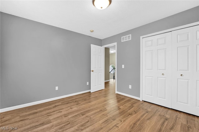 3527 Perry Ct, Lorain, OH 44053 - unfurnished bedroom featuring wood finished floors, baseboards, and a closet