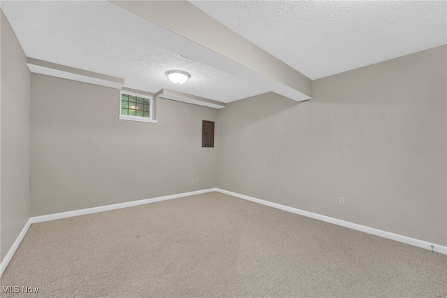 3527 Perry Ct, Lorain, OH 44053 - basement with a textured ceiling, carpet floors, baseboards, and electric panel
