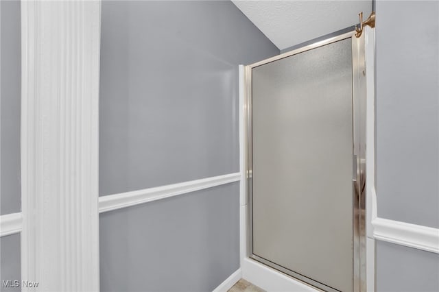 3527 Perry Ct, Lorain, OH 44053 - full bathroom featuring a stall shower and a textured ceiling