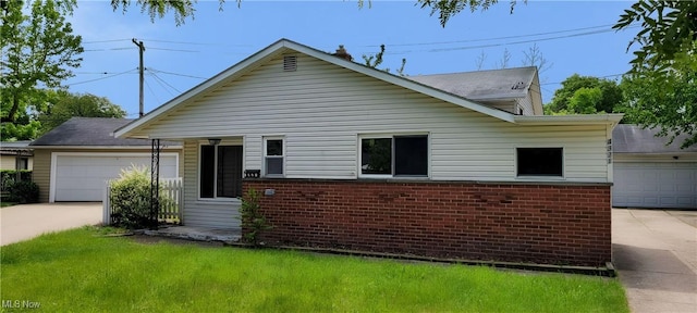 4321 W 181st St, Cleveland, OH 44135 - view of front of property with a garage, brick siding, driveway, and a front yard