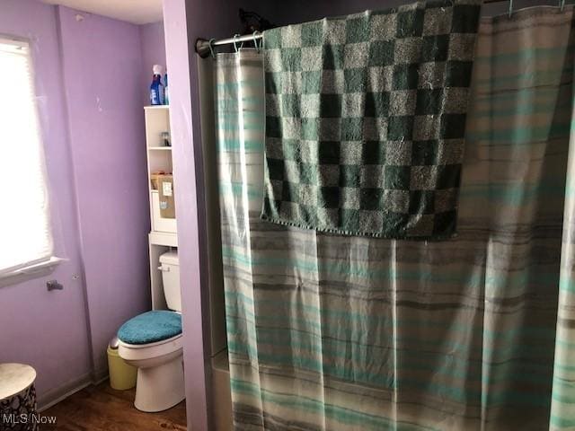 1817 Penn Pl NE, Canton, OH 44704 - bathroom with toilet, wood finished floors, and a shower with curtain