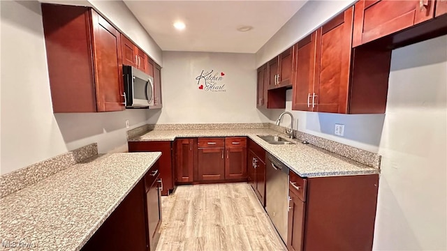 24 Washington Sq, Euclid, OH 44143 - kitchen featuring appliances with stainless steel finishes, a sink, light wood-style flooring, reddish brown cabinets, and recessed lighting