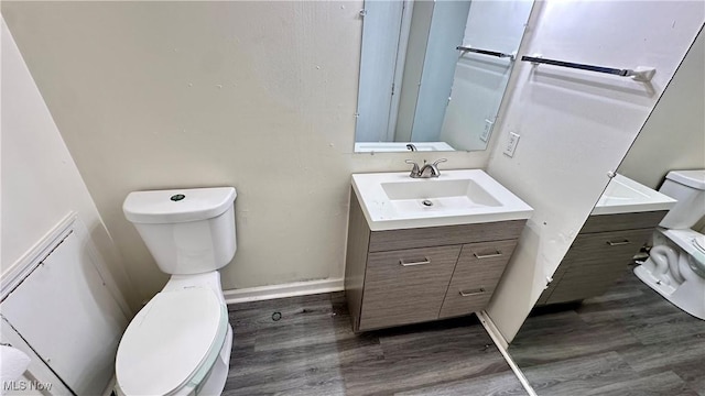 24 Washington Sq, Euclid, OH 44143 - bathroom featuring toilet, vanity, wood finished floors, and baseboards