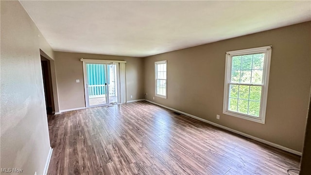 24 Washington Sq, Euclid, OH 44143 - spare room featuring wood finished floors and baseboards