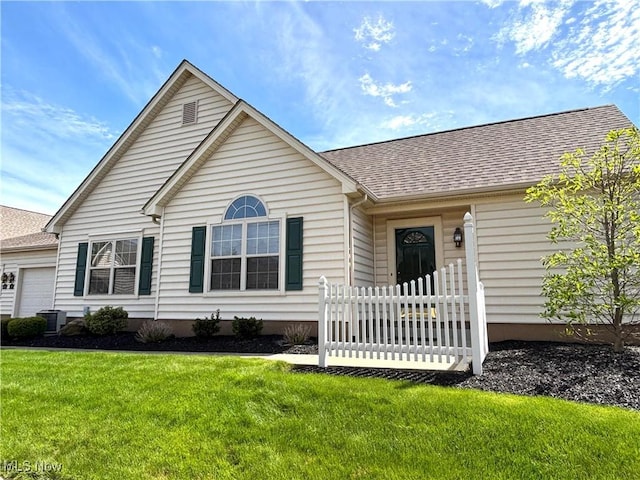 39 Village Ct, Columbiana, OH 44408 - single story home featuring a garage, a front lawn, roof with shingles, and central air condition unit