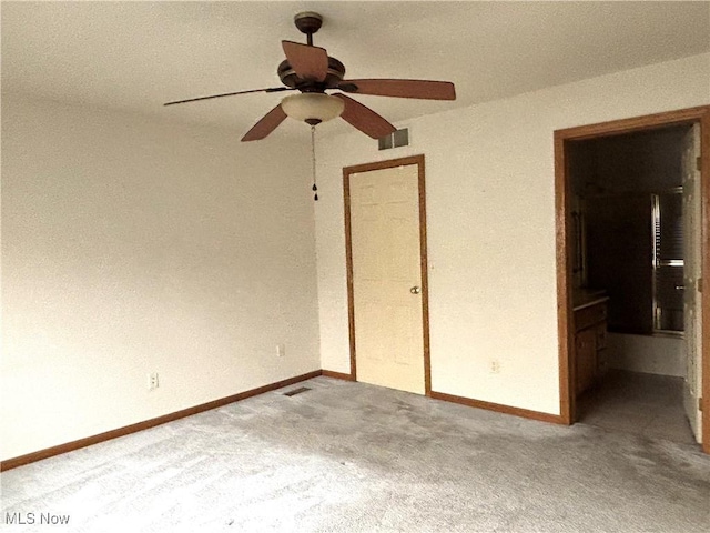 39 Village Ct, Columbiana, OH 44408 - unfurnished bedroom featuring carpet floors, baseboards, and ceiling fan