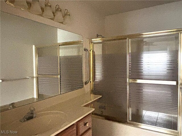 39 Village Ct, Columbiana, OH 44408 - bathroom with enclosed tub / shower combo and vanity