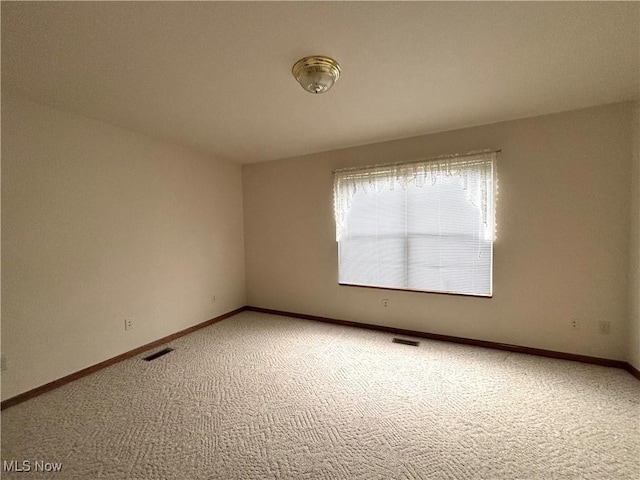 39 Village Ct, Columbiana, OH 44408 - carpeted spare room featuring baseboards